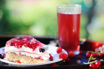 cake with berries outdoor with berries juice. spring green blackberry strawberry biscuit cake outdoor party