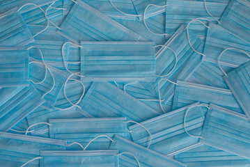 Many stacked medical blue masks