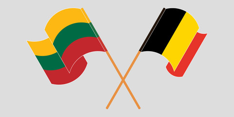 Crossed and waving flags of Lithuania and Belgium