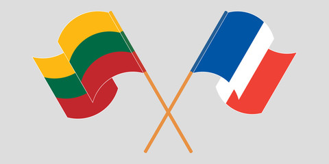 Crossed and waving flags of Lithuania and France