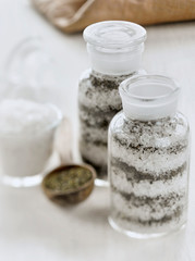sea salt with mint in a jar on a white background
