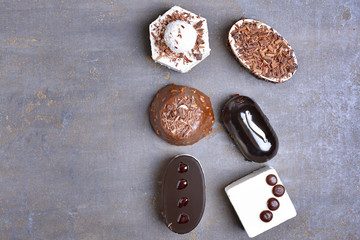 Tasty cakes on dark background