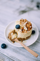 Healthy dessert cake with granola base and mango puree cream. Healthy vegetarian dessert concept. Space for your text