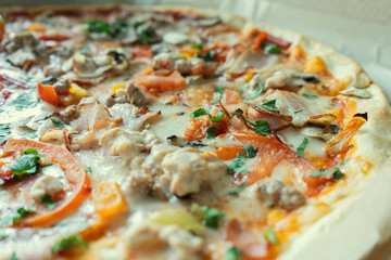 Tasty pizza with tomatoes, bacon and cheese