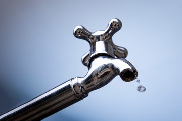 Drain water from the Metal tap, Water flowing from modern faucet