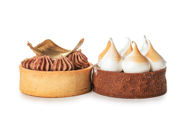 Tasty cakes on white background