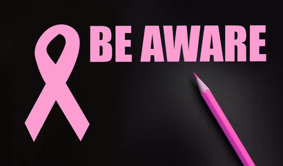 Pink Breast Cancer Ribbon with Be aware words. Healthcare concept
