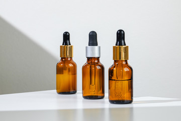 Oily skincare moistrizing brown glass jar with pipette close up