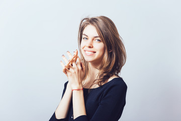 Naklejka premium Closeup portrait of a young woman praying