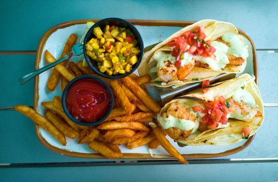 Chicken Tacos With French Fries, Pico De Gallo, Corn Salad. Top Down.