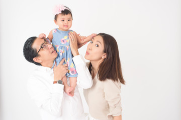 Obraz na płótnie Canvas Happy Asian family on white background