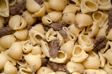 pasta horns cooked with pork meat, close-up