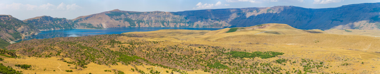 Panorama of Nemrut crater lake, Bitlis Province, Eastern Turkey. Panoramic view of the volcano Nemrut. Beautiful blue mountain lake. Amazing landscape