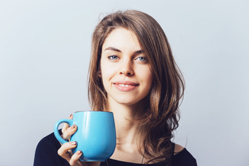 girl holding a cup