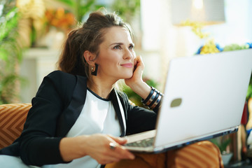 pensive woman in modern house in sunny day and reading text