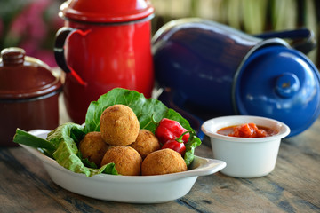 Gastronomy. Traditional food from northeastern Brazil. Goat meat dumpling with hot sauce