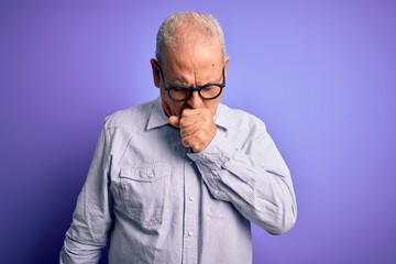 Obraz premium Middle age handsome hoary man wearing striped shirt and glasses over purple background feeling unwell and coughing as symptom for cold or bronchitis. Health care concept.