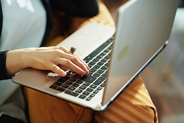elegant woman in house in sunny day doing research