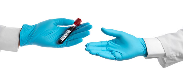 Female hand holding test tube with blood for Covid-19 (coronavirus) analyzing. Laboratory testing patient’s blood isolated on white