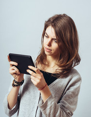 Naklejka premium young woman using digital tablet computer