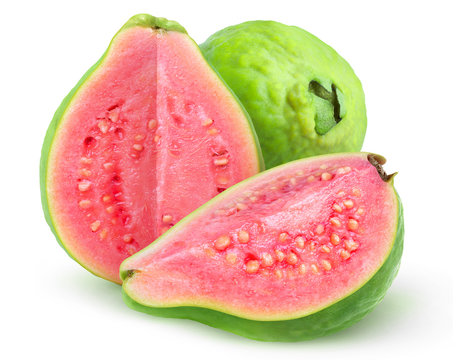 Isolated guava fruits. Pink guavas with green skin cut in halves isolated on white background with clipping path