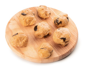 Board with sweet dough for cookies on white background
