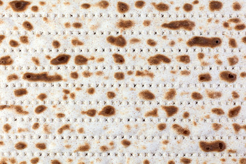 Matzah. Jewish traditional Passover bread. Pesach celebration symbol. With some free space for your text or sign . Close-up.