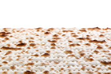 Matzah. Jewish traditional Passover bread. Pesach celebration symbol. Isolated on white. With some free space for your text or sign . Close-up.