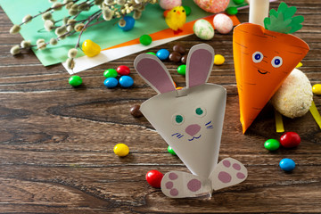 The packaging paper in the form of carrots and the Easter Bunny. Handmade. Project of children's creativity, handicrafts, crafts for kids.