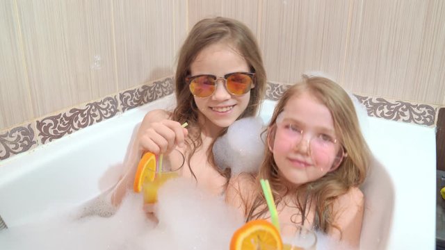 children relax in tub. cannot leave country.