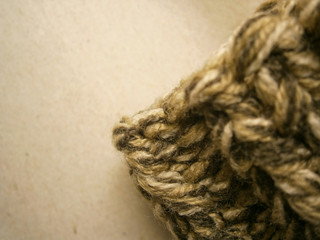 Knitted fabric on a gray background with blurry effect.