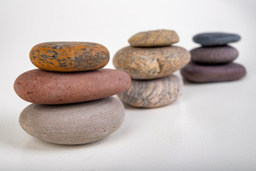 Fototapeta na wymiar Round stones stacked. Stones found on the sea beach.