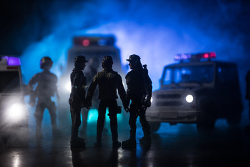 Police cars at night. Police car chasing a car at night with fog background. 911 Emergency response...
