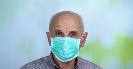 portrait of old bald aged man wearing facemask