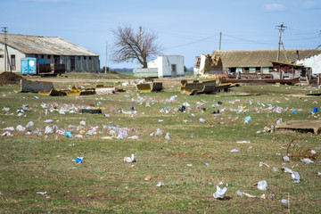 Garbage from plastic bags on the ground. Plastic bags. Dirty land. Ecological catastrophy