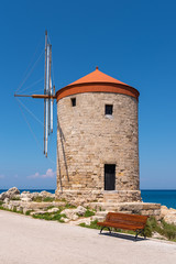 Historic windmill overlooking Mandraki port. Rhodes island, Greece