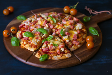 Tasty pizza with chicken and ham. Italian food
