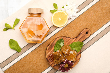 Jar of sweet honey on table