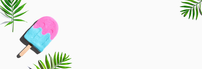 Popsicle with tropical plants - overhead view flat lay