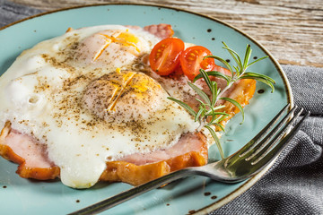 Fried eggs with pork ham.