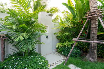 Exterior design of outdoor shower in garden of pool villa, house, and home