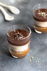 Cup chocolate dessert with coconut cream 