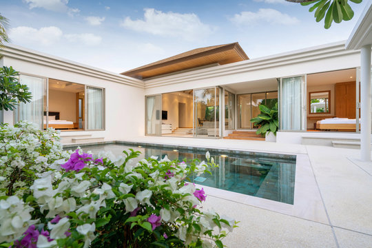 Exterior design of pool villa, house and home feature infinity swimming pool and garden
