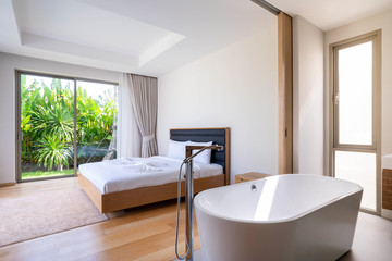 Interior design of bedroom with bathtub in villa, house, home, condo and apartment