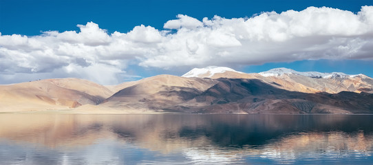 Fototapeta na wymiar Himalayan mountains mirrored reflected in Tso Moriri mountain Lake water surface near Karzok or Korzok village in the Leh district of Ladakh, India.