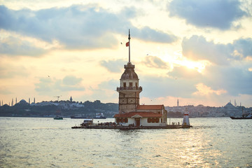 Fiery sunset over Bosphorus with famous Maiden's Tower (Kiz Kulesi in Turkish) also known as Leander's tower, symbol of Istanbul, Turkey
