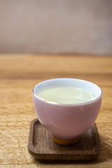 White checker with green tea. Tea Cheremonia. Wooden table