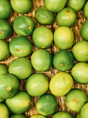 lots of ripe green limes for eating background