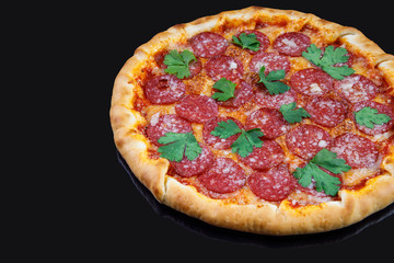 italian pizza with salami on a black background for a restaurant menu