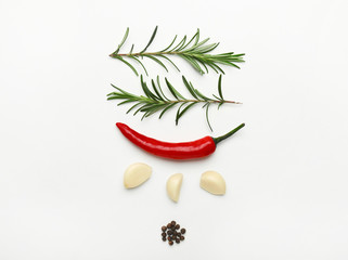 Fresh rosemary and spices on white background